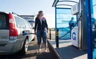 Refueling with biogas at a Gasum station in Finland