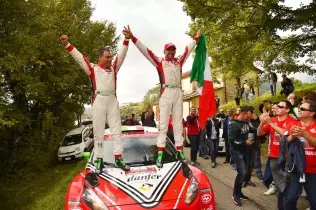 Giandomenico Basso and Lorenzo Granai (right to left) celebrate their championship