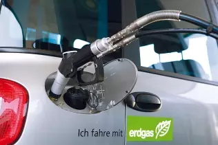 A car refueling with CNG at a fuel station in Germany