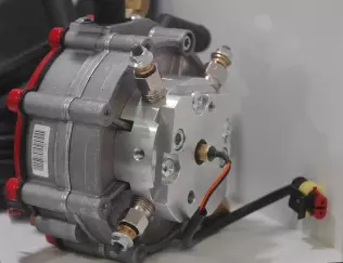 An AC reducer with an electrical heater on it